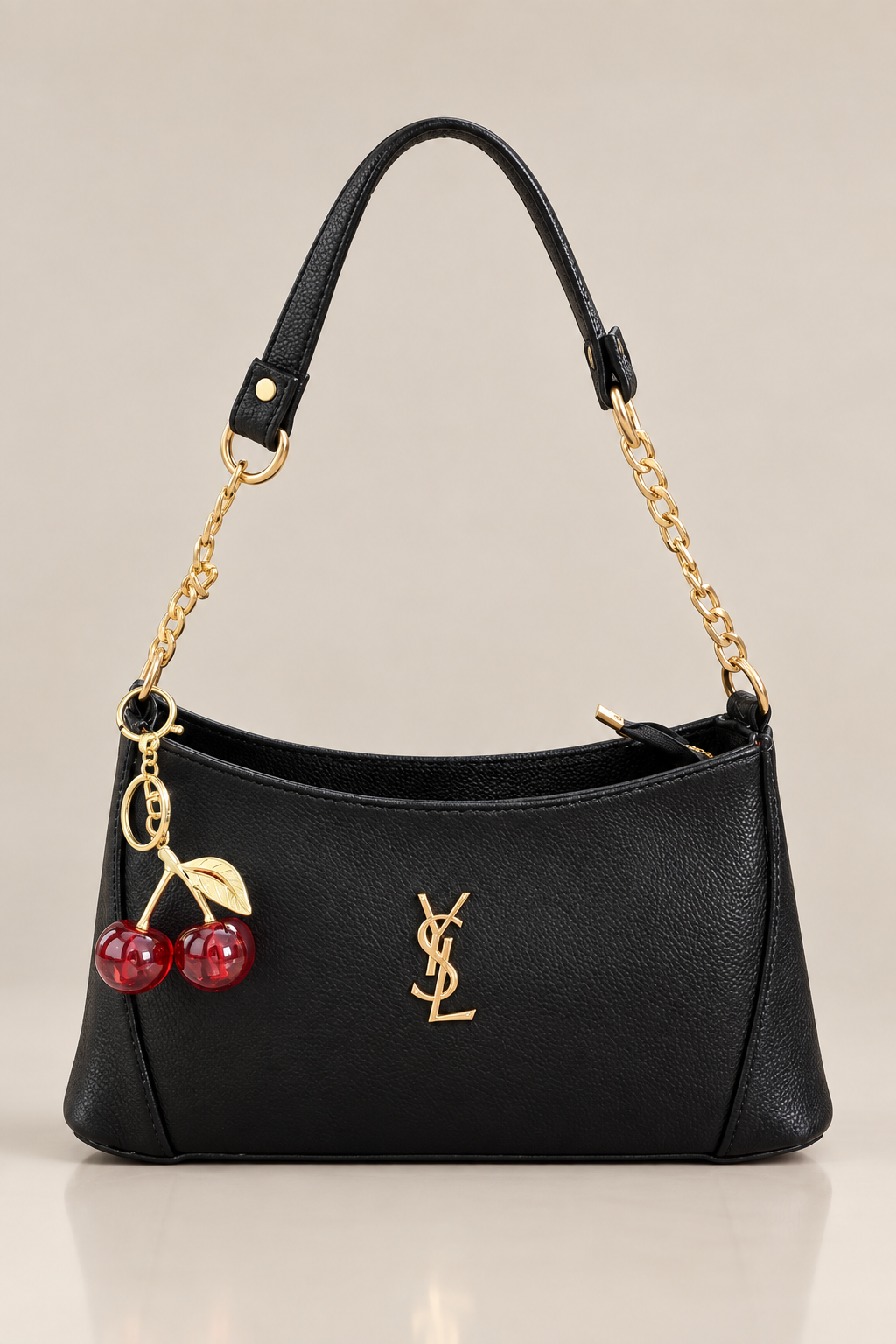 Black handbag in a minimal studio setting